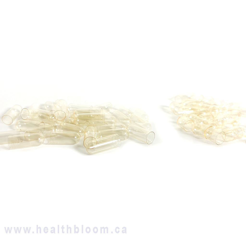 Empty vegan capsules  separated and displayed on a white background with the watermark 'www.healthbloom.
