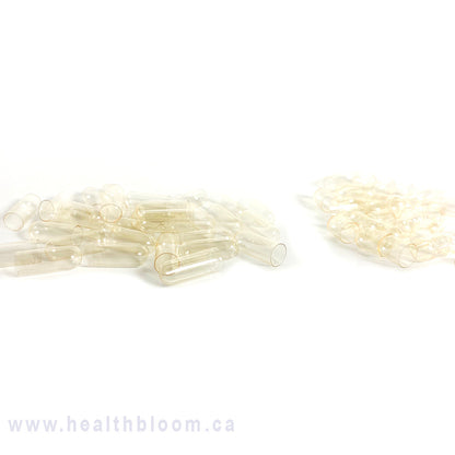 Empty vegan capsules  separated and displayed on a white background with the watermark 'www.healthbloom.