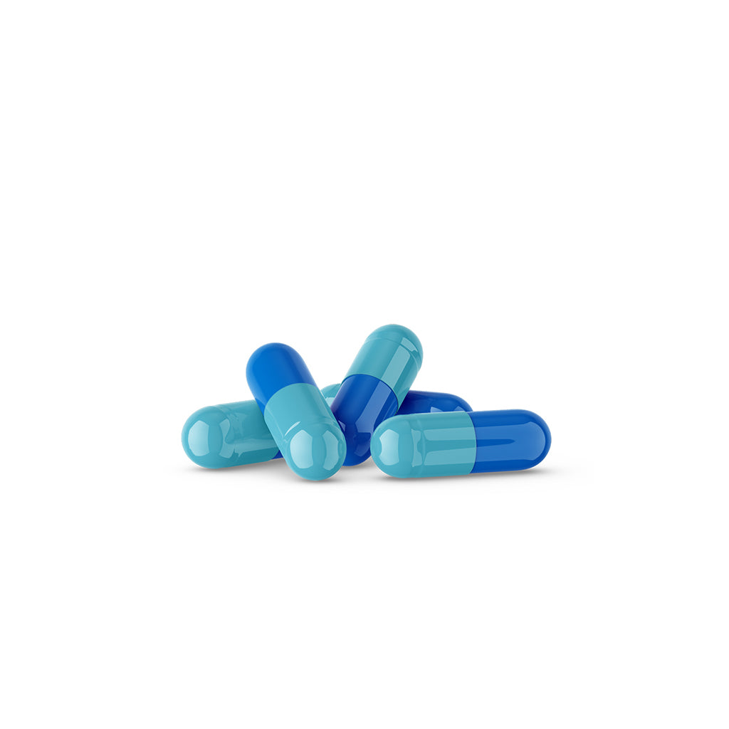 A photograph of empty gelatin capsules in light and dark blue colors.